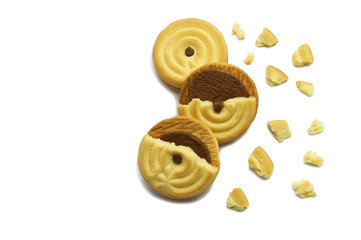 Sandwich cookies filled with coffee cream flavored. Some broken and crumbs of crunchy delicious sweet meal and useful cookie on white background.