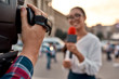 © Svitlana - We report to you. TV reporter presenting the news outdoors. Journalism industry, live streaming concept.