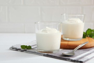 Wall Mural - Natural white yogurt on the table. Healthy snack, Greek yogurt.