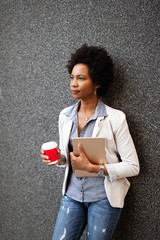 Wall Mural - Beautiful happy professional business woman smiling happy with tablet outdoor