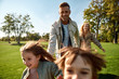 © Svitlana - Happy weekend. Excited family running outdoors on a sunny day