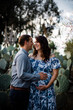 © Cavan Images - Husband and Pregnant Wife in Cactus Garden