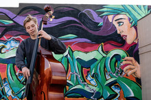 High School Jazz Band Musician Playing Double Bass By Graffiti