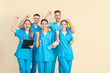 © Pixel-Shot - Group of happy medical students on light background