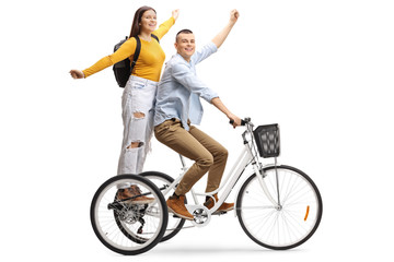 Canvas Print - Happy young male and female on a tricycle