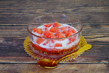 Wall Mural - Thai dessert : Crunchy red rubies or Tab Tim Krob, made from water chestnut, tapioca starch, coconut milk and sugar syrup. Famous Thai iced dessert. Selective focus with copy space.