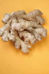 Ginger root close-up  on a bright  yellow background. Organic bio healthy vegetables and spices.