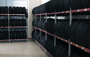 Canvas Print - Car tires on rack in auto store