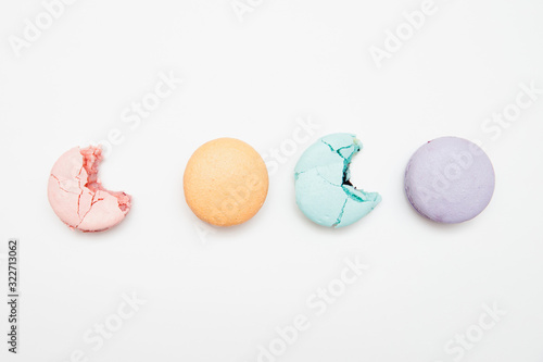 Fotomural Colorful turquoise, pink, orange, purple cake French macaron or macaroon bitten