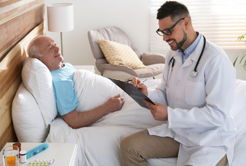 Sticker - Doctor examining senior patient in modern hospital