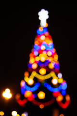 Wall Mural - The lights of the Christmas tree, the silhouette from the bokeh