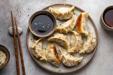 Sticker - Traditional japaneese gyoza dumplings with meat and mushrooms on ceramic plate