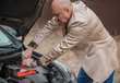 © T.Den_Team - Senior man have a trouble automobile. Mature older man with a car problem, lifestyle