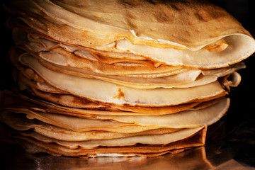 pancakes stack on black background close up shot