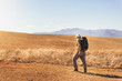 © Mediteraneo - Senior man on hike through beautiful countryside in autumn.