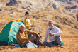 © Mediteraneo - Three generations of family camping together in the autumn.