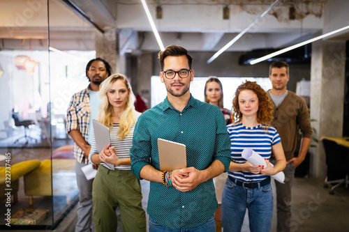 Cuadros en Lienzo Successful company with happy employees in modern office