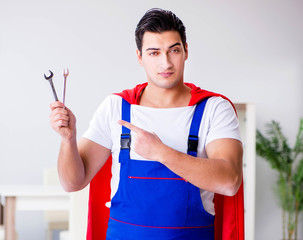 Superhero repairman with tools in repair concept