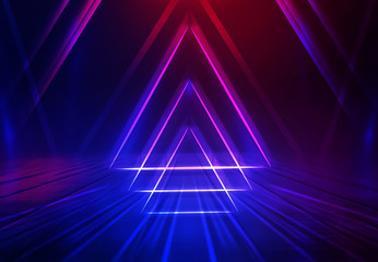 Dark abstract futuristic background. Geometric laser figure in the center of the stage. Neon blue-pink rays of light on a dark background