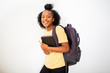 © mimagephotos - smiling african american girl student with bag and books by isolated white background