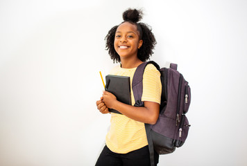 african american teenage girl student smiling with bag and books by isolated white background