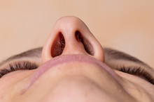 Nose Of A Woman Seen From Below. Laser Hair Removal Concept Of Nose Hair