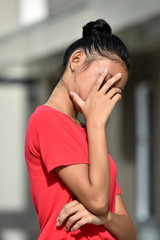 Wall Mural - An Unhappy Filipina Girl