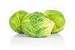 Group of three whole fresh green brussels sprout isolated on white background