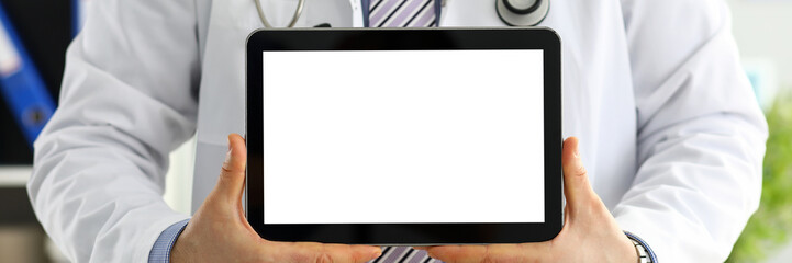 Canvas Print - Male doctor holding digital tablet pc