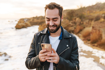 Sticker - Handsome young bearded man wearing a jacket