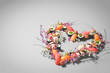 Heart made of sushi and flowers. Love sushi. Valentines Day (14 February), Mother's day, Woman's day (8 March) or spring concept. Creative romantic. Japanese sushi set on gray background. Copy space