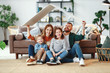 © JenkoAtaman - concept housing a young family. mother father and children in  new home.