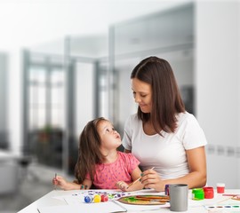 Canvas Print - Happy beautiful mother and daughter playing together