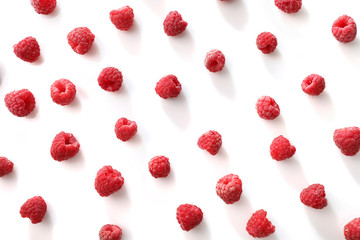 Wall Mural - Texture of red ripe raspberries isolated on white background