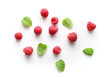 Ripe rasberries and mint isolated on white background. Top view