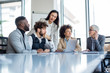 © Sanja - A crew of professionals having a meeting in the boardroom.