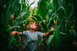 © RooM The Agency - Boy playing in a corn field, USA