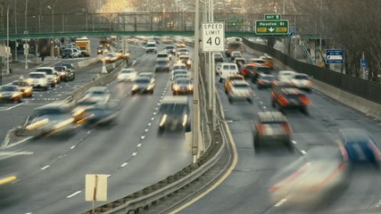 timelapse of new york highway with car traffic in rush hour and bridge