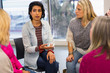 © Chris Ryan/Caia Image - Women talking in support group circle