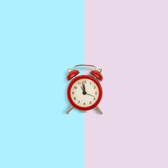 retro alarm clock on pink background. Concept of time with free space for text