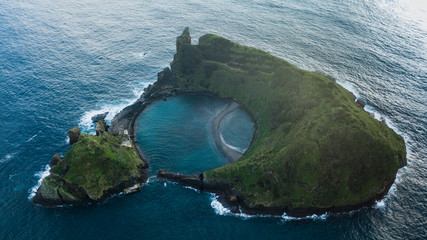 Wall Mural - Drone aerial view of Islet of Vila Franca do Campo in San Miguel island, Azores, Portugal.