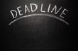 Deadline text on blackboard, business concept background