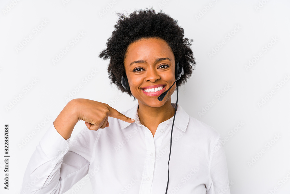 Young african american telemarketer woman isolated person pointing by hand to a shirt copy space, proud and confident - obrazy, fototapety, plakaty 
