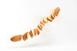Baguette with sesame seed flying in air. Fresh baked bread sliced, cut. Traditional bakery product french baguette. Delicious crispy wheat bread, levitation, fly food concept