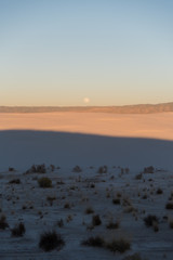 Wall Mural - Full moon during sunset at White Sands National Park in Alamogordo, New Mexico. 