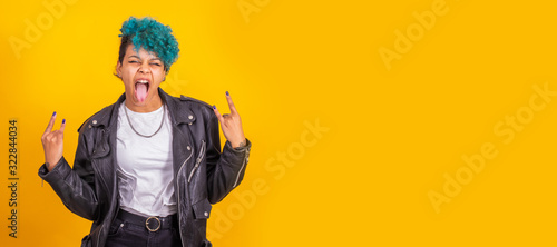Cuadros en Lienzo modern young girl with rebel expression isolated on color background