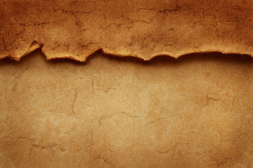 Wall Mural - Torn crumpled damaged edge of old ancient vintage paper over another sheet of antique paper. Header for website, banner, flyer, menu or booklet.