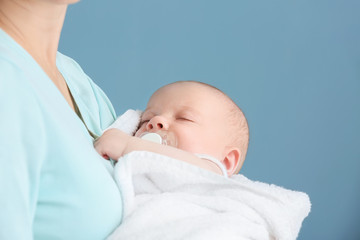 Wall Mural - Young mother with little baby at home, closeup