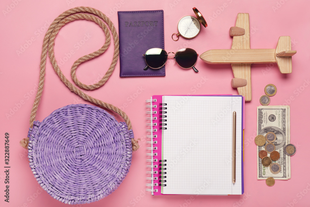Set of travel accessories on color background