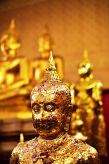 Golden statue of buddha in temple, Thailand	